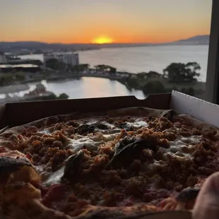 Margherita with sausage added, watching the sunset.