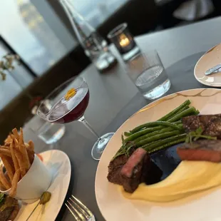a plate of steak and french fries
