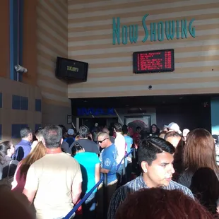 The IMAX sign is back there somewhere, behind the going to see Godzilla crowd.