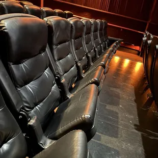 Comfy-ish chairs. The theater is clean tho!