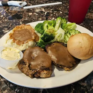Meatloaf,  mash potatoes, and steamed garlic broccoli