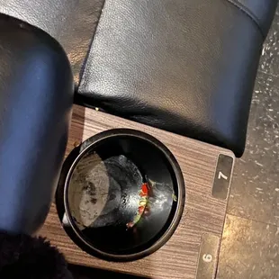 Food and trash from past guests in the cup holder wear we sat down.