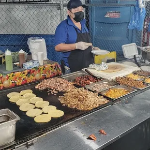a group of people preparing food