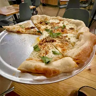 a pizza with a slice missing