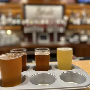 Beer sampler in a muffin tin.