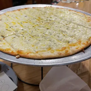 a cheese pizza on a tray