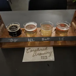 a flight of beers on a table