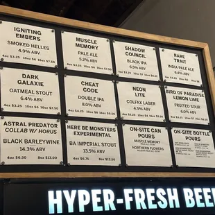 a sign with a list of beers