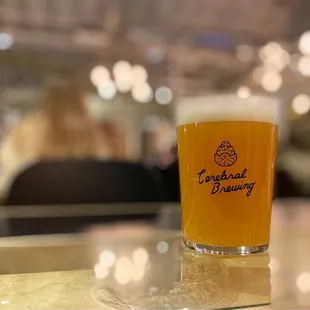 a glass of beer on a table