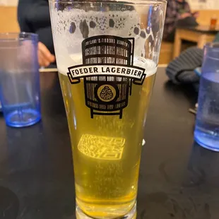 a glass of beer on a table