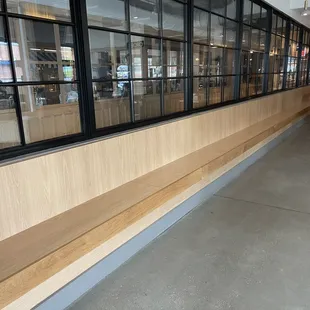 Looong empty benches, tables all down at the far end