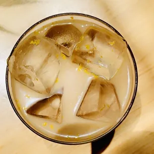 Zest for Life -- iced oat milk mocha infused with house made orange syrup, topped with fresh orange zest