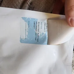 Full picture of Peru Cenfrocafe sticker lifted to show Climate Project printed on bag