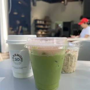 Matcha latte with cherry blossom foam topped with rose petals