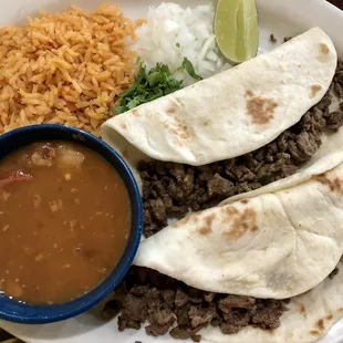 Carne Asada Tacos plate with rice &amp; charro beans.