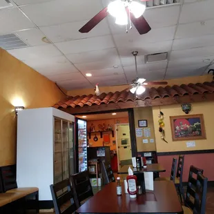 a dining room with a ceiling fan