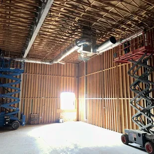 HVAC ductwork installation new construction site.