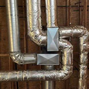 HVAC ductwork installation new construction site.