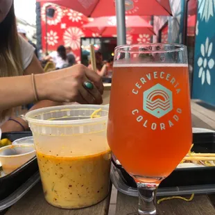 Enjoying a sour outside on the patio with dinner from Daughter Thai across the street!