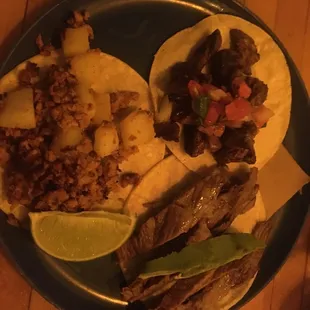 Tacos de corizo en papas (left), cecina (bottom) and asada (right)
