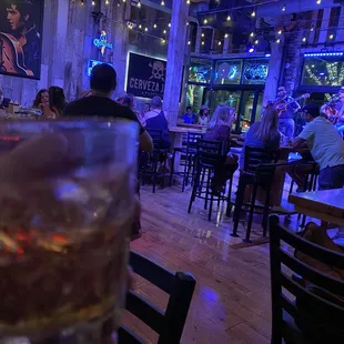 a man holding a glass of whiskey