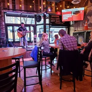 people sitting at a bar