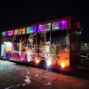 a double decker bus at night