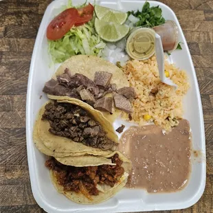 3 tacos and beans and rice. $10 ish. October 2024