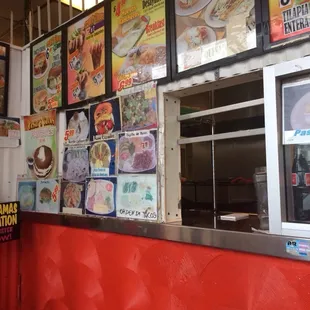 This is the inside of the restaurant where you order, with pictures of the menu all around.