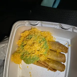 3 rolled tacos with cheese and guacamole!