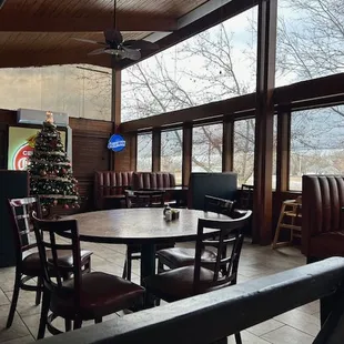 a dining area with a christmas tree