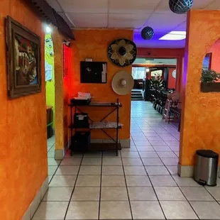 a tiled floor and orange walls