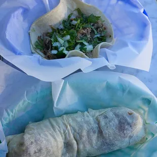 Carnitas taco next to a carnitas burrito