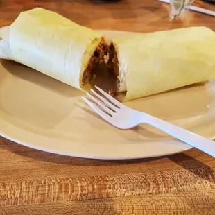 Breakfast burrito just arrived, wrapped.
