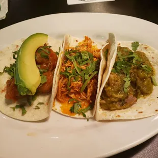 (Left to right) Shrimp taco, Chicken tinga no queso, Costillas en salsa verde