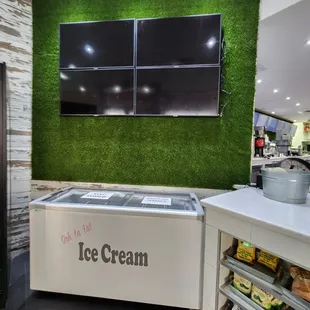 an ice cream shop with artificial turf