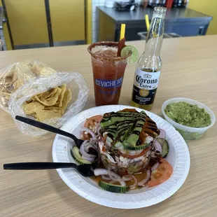 The Works Ceviche with Chips and Guacamole, Michelada with Corona.