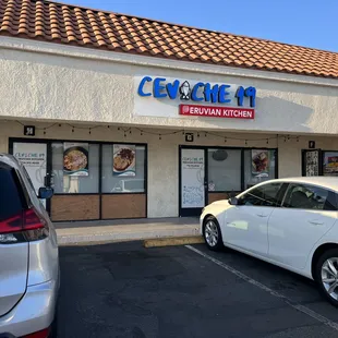 a car parked in front of a restaurant