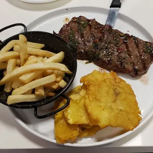 Churrasco, fries and tostones
