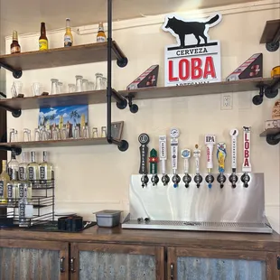 a beer tap and shelves