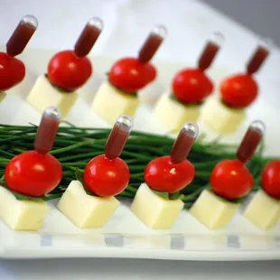 Caprese Explosion with Mozzarella, Tomato, Basil, and Balsamic Vinaigrette squeezed through a pipette