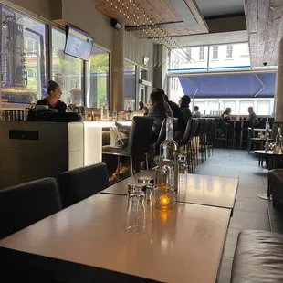 people sitting at tables in a restaurant