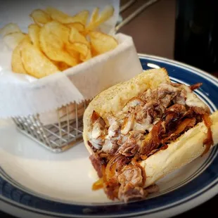 a plate with a sandwich and chips