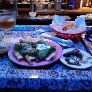 Chicken and beef quesadillas with grilled serrano jalapeno peppers.