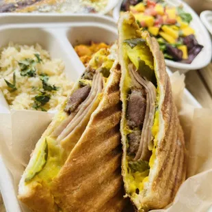 Sandwich Cubano , with home made roasted pork, ham, queso , pickle and mustard.