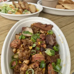 Arroz Paisa is a traditional dish from Colombia made with fried rice, chicken, Colombian sausage, chicharrón and corn.