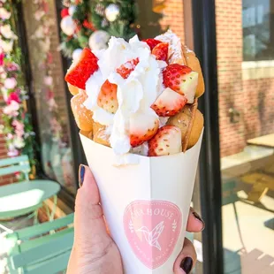 Chocolate chip egg waffle with whipped cream and strawberries