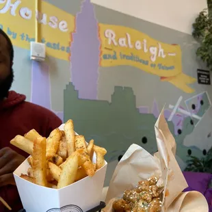 a man sitting at a table with food