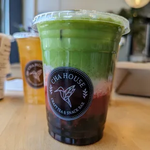 Strawberry Matcha Latte with soy milk, half sugar, and boba. Medium. $7.10.