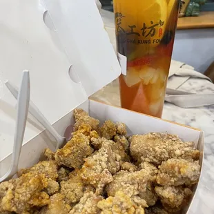 a box of chicken nuggies and a drink